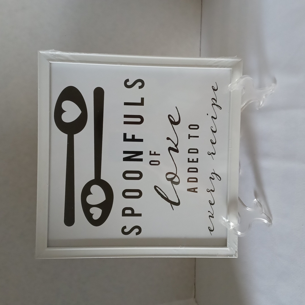 Wall decor,  picture frame.  "Spoonfuls of love added to every recipe " .